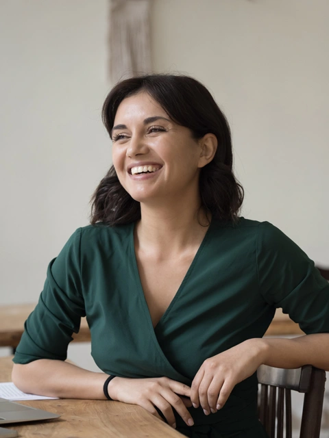 Woman patient smiling wearing green shirt